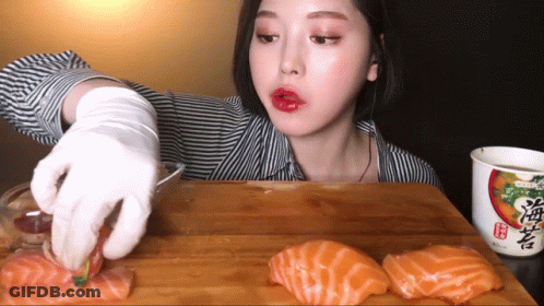 Woman Eating Sushi Next To Ramen Soup GIF