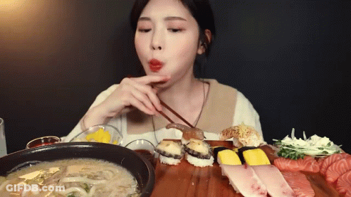 Woman Eating Sushi With Chopsticks And Soup GIF