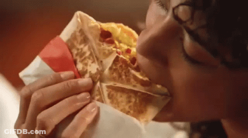Woman Eating Taco With Red Ribbon GIF