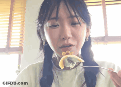 Woman Eating With Fork In Mouth GIF