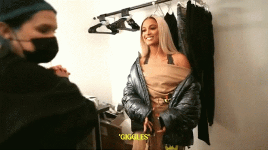 Woman Enjoys Sensible Chuckle In Dressing Room GIF