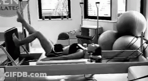 Woman Exercising On Pilates Machine Black And White GIF