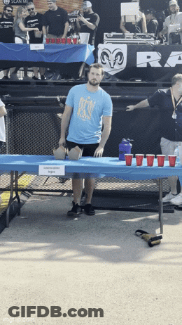 Woman Eyes Closed Hot Dog Thrown At Face GIF