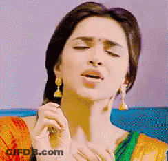 Woman Eyes Closed In Red And Green Dress GIF