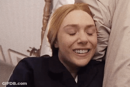 Woman Eyes Closed With Man's Arm Behind Her GIF