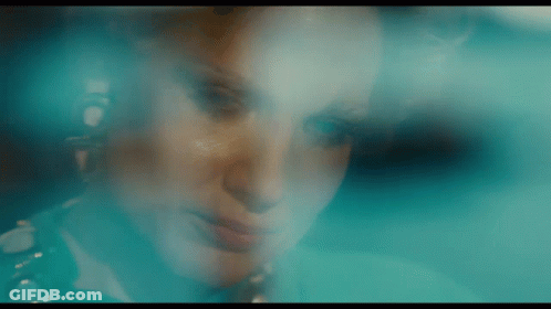 Woman Face Behind Blue Background GIF