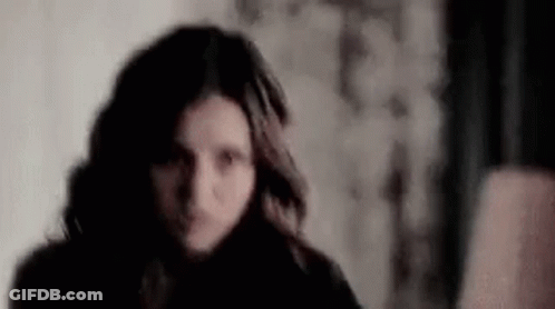 Woman Face Close Up In Dark Room GIF