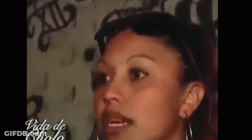 Woman Face Close Up In Front Of Wall GIF