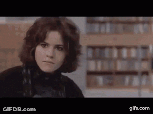 Woman Face Close Up In Library GIF