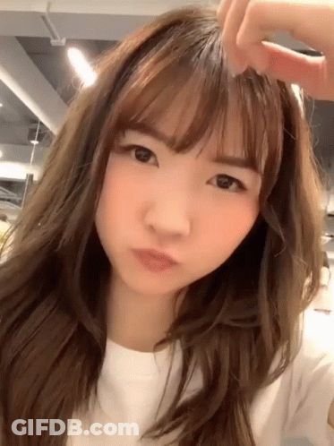 Woman Face Close Up Long Hair Bangs GIF
