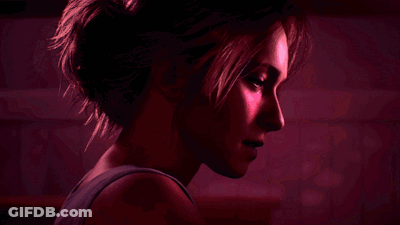 Woman Face Close Up On Red Background GIF