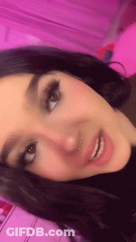 Woman Face Close Up Pink Background GIF