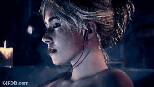 Woman Face Close Up With Earbuds GIF