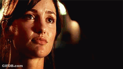 Woman Face Close Up With Man Behind GIF