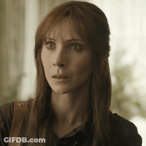 Woman Face Close Up With Purse GIF