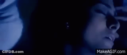 Woman Face In Dark With Eyes Closed GIF
