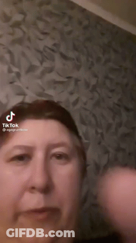 Woman Face In TikTok Video With Purple Background GIF