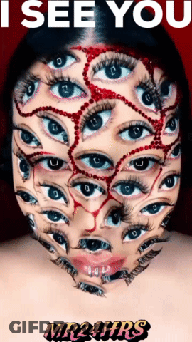 Woman Face Painted With Many Eyes Saying I See You GIF