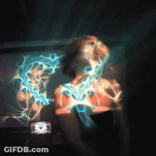 Woman Face Projected On Wall With Clock GIF