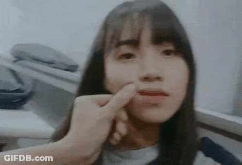 Woman Face Touched By Hand GIF