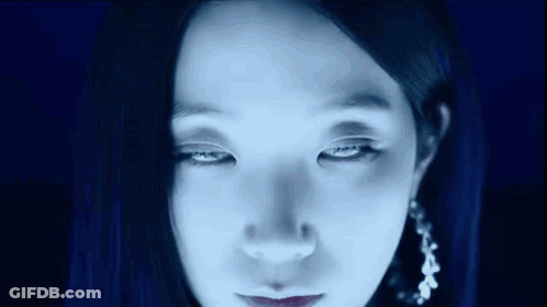 Woman Face With Blue Light Shining On Eyes GIF