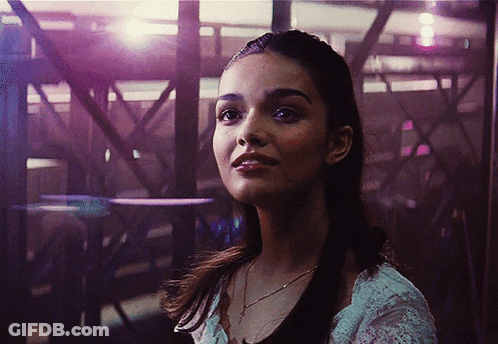 Woman Face With Purple Light Behind GIF