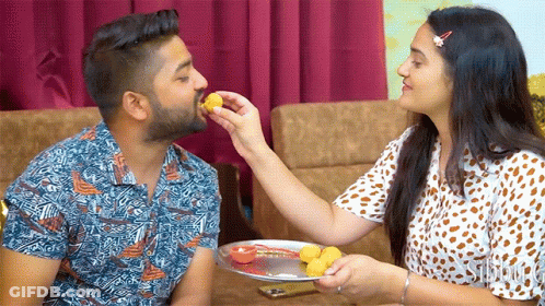 Woman Feeding Man Food From Plate GIF