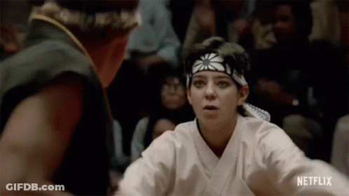 Woman Fighting Man In Karate Ring GIF