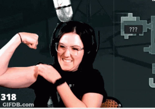 Woman Flexing Muscles In Front Of Microphone With Number 318 GIF