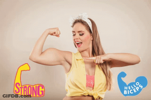Woman Flexing Muscles In Front Of Strong Sign GIF