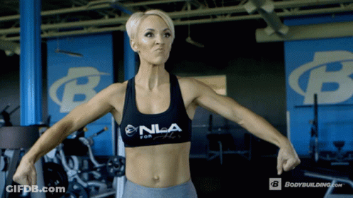 Woman Flexing Muscles In Gym In NLA Top GIF