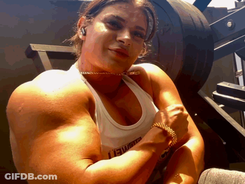 Woman Flexing Muscles In Lewis Tank Top GIF