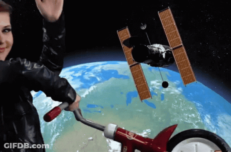 Woman Floating Against Planet With Bicycle GIF