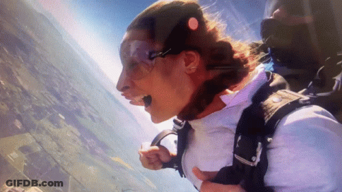 Woman Flying With Parachute GIF