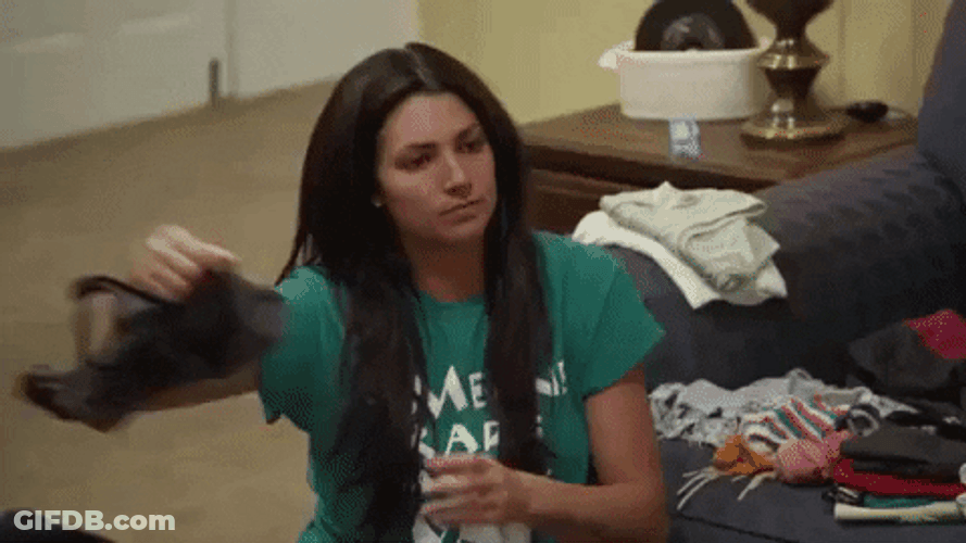 Woman Folding Clothes With Side Eye Meme GIF