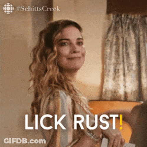 Woman From Schitt's Creek Smiling Says Lick Rust GIF
