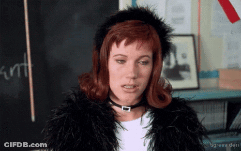 Woman Fur Coat Choker Blackboard Saying Cunt GIF