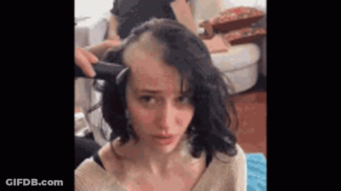 Woman Getting Hair Shaved By Man With Razor GIF