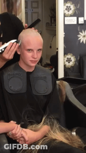 Woman Getting Haircut By Barber In Black Cape GIF