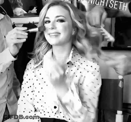 Woman Getting Makeup Done At Nightseth Sign GIF