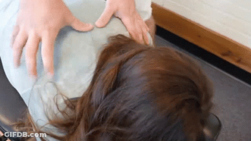 Woman Getting Massage From Doctor's Hands GIF