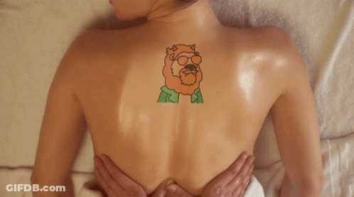 Woman Getting Massage With Back Tattoo GIF