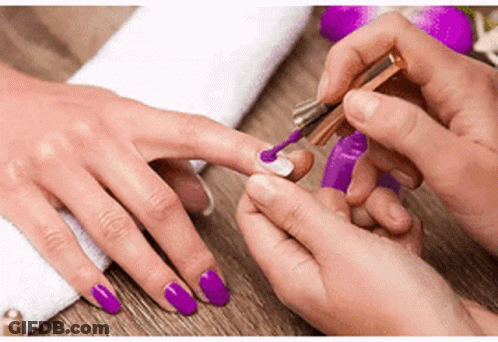 Woman Getting Nails Painted Purple At Salon GIF