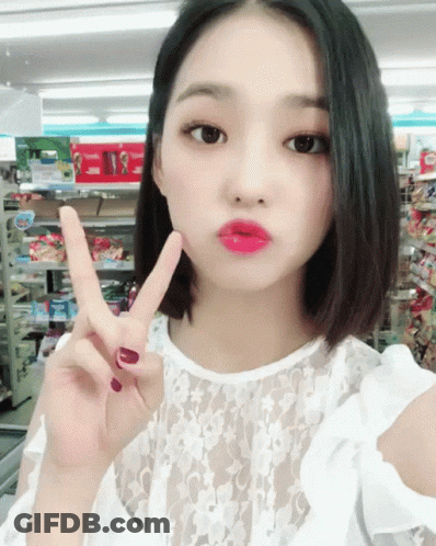 Woman Giving Peace Sign GIF