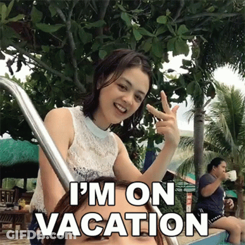 Woman Giving Peace Sign Next To Swimming Pool Saying I'm On Vacation GIF