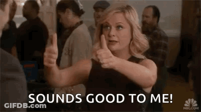 Woman Giving Thumbs Up In Front Of Crowd GIF