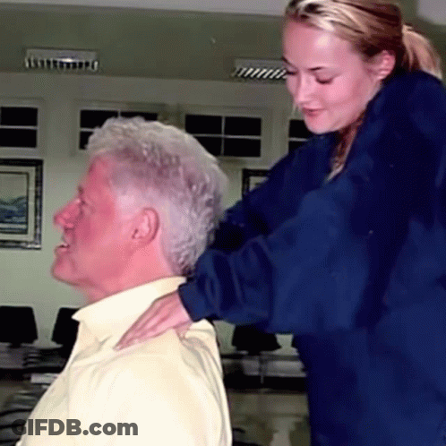 Woman Hand On Older Man's Neck GIF