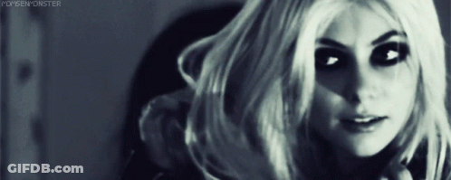 Woman Hand To Forehead In Black Tank Top GIF