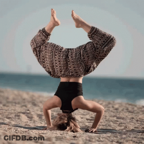 Woman Handstand Head In Sand On Beach GIF