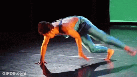 Woman Handstand On Stage With Green Screen GIF